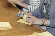 Politics, UK, Election, Close up of hands during the count in Tunbridge Wells, Kent, England.