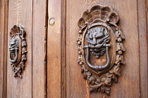 Italy, Tuscany, Lucca, Barga, Door knockers in the old town.