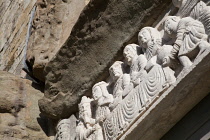 Italy, Tuscany, Lucca, Barga, Frieze above the side door to the Duomo Cathedral.