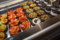 Italy, Tuscany, Lucca, Barga, Display of pastries in Luchessi's bar and cafe.