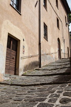 Italy, Tuscany, Lucca, Barga, Via del Duomo in the old town leading up to the Cathedral.