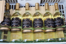 Italy, Tuscany, Lucca, Barga, Bottles of Pinot Grigio white wine for sale in the old town.