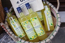 Italy, Tuscany, Lucca, Barga, Bottles of Limoncello for sale in the old town.