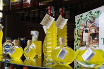 Italy, Tuscany, Lucca, Barga, Display of Limoncino in an Enoteca regional wine shop.