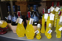 Italy, Tuscany, Lucca, Barga, Display of Limoncino & Ruffino Chiante in an Enoteca regional wine shop.