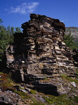 Norway, Finnmark, Landscape, Stratified soft rocks beside road to Nordkapp on the westbank of Porsanger Fjord.