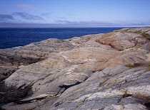 Norway, Finnmark, Grense Jakobselv, Glaciated granite rocky shelf on the edge of Barents Sea.
