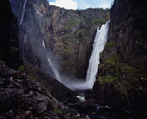 Norway, Hordaland, Mabodalen, Lower section of Voringsfossen waterfall cascading into steep sided valley gorge.