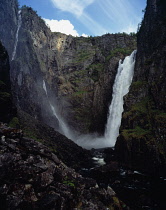Norway, Hordaland, Mabodalen, Lower section of Voringsfossen waterfall cascading into steep sided valley gorge.