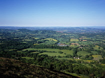 England, Herefordshire, View south west from the Malvern Hills across patchwork of agricultural land and small clusters of buildings.