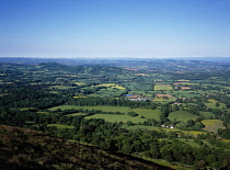 England, Herefordshire, View south west from the Malvern Hills across patchwork of agricultural land and small clusters of buildings.
