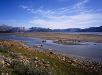 Norway, Finnmark, Tana River, View north from the west bank of the Tana River about two kilometres from the river mouth with tide out.