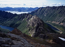 Norway, Lofoten, Vagan, View west showing rugged landscape of Lofoten with jagged Sorfjellet Ridge at centre  Nordfjellet Ridge on right and Djupfjordvatnet Lake on left