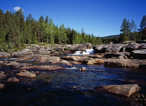 Norway, Telemark, Tessungdalen, River Austbygdaa showing polished granite bedrock.