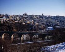 France, Midi Pyrenees, Aveyron, Medieval city of Rodez in winter time with railway viaduct.