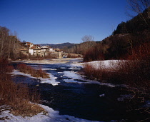 Spain, South Pyrenees, Navarra, Valle de Roncal. Vill of Burghi by Rio Esca, part frozen