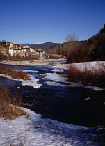Spain, South Pyrenees, Navarra, Valle de Roncal. Vill of Burghi by Rio Esca, part frozen