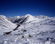 France, Ariege, View north from point 1875m over Upper Valley Ariege with Pic d' Auriol (cent) 2695m (8826ft) Taken in Febuary.