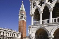 Italy, Venice, St Mark's Campanile or bell tower viewed from the Piazzetta di San Marco with a corner of the Doge's Palace on right.