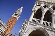 Italy, Venice, St Mark's Campanile or bell tower viewed from the Piazzetta di San Marco with a corner of the Doge's Palace on right.