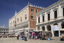 Italy, Venice, The Doge's Palace with souvenir stands in the foreground.