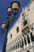 Italy, Venice, The Doge's Palace, a section of the facade with a lampstand.