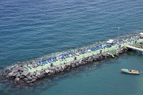 Italy, Campania, Amalfi Coast, Sorrento, Harbour Pier with sunbathers.