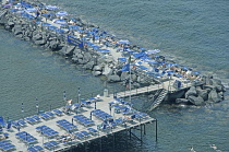 Italy, Campania, Amalfi Coast, Sorrento, Harbour Pier with sunbathers.