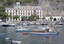 Italy, Campania, Amalfi Coast, Amalfi Harbour with motorboats.