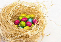 Festivals, Religious, Easter, Close up of mini chocolate eggs in straw bed.