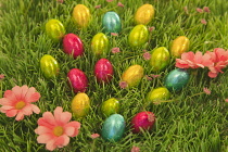 Festivals, Religious, Easter, Mini chocolate eggs sat on green Astroturf.