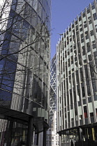 England, London, The Modern skyline of the City of London with The Gherkin Building viewed between two modern office blocks.