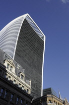 England, London, The Walkie Talkie Building viewed above the rooftops of offices in Great Tower Street.