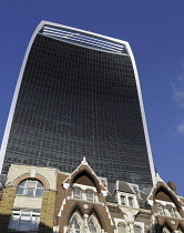 England, London, The Walkie Talkie Building viewed above the rooftops of offices in Great Tower Street.