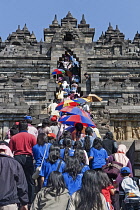 Indonesia, Java, Borobudur, Crowd crush in the midday heat at the main entrance stairway.