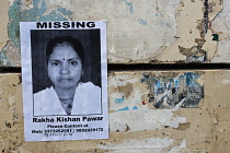 India, Maharashtra, Mumbai, Home-made poster for a missing woman stuck on a city-centre wall.