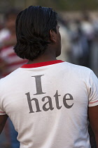 India, Maharashtra, Mumbai, Teenage male wearing a T shirt with the words 'I hate' printed on the back.