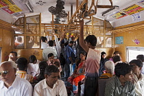 India, Maharashtra, Mumbai, Interior of second class carriage of a surburban train.