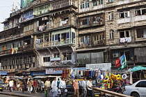 India, Maharashtra, Mumbai, Old buildings lining a street near Crawford Market.