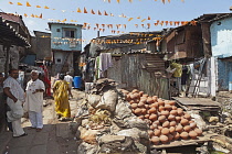 India, Maharashtra, Mumbai, Clay pots drying in the sun in the potters' quarter of Dharavi slum.