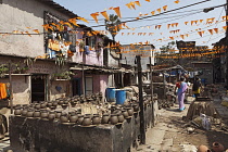 India, Maharashtra, Mumbai, Clay pots drying in the sun in the potters' quarter of Dharavi slum.