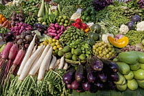 India, West Bengal, Calcutta, Wide selection of locally grown vegetables on sale on a market stall.