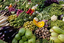 India, West Bengal, Calcutta, Wide selection of locally grown vegetables on sale on street-market stall.