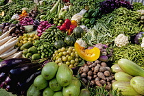 India, West Bengal, Calcutta, Wide selection of locally grown vegetables on sale on street-market stall.