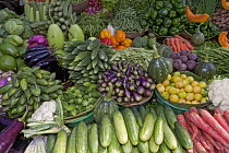 India, West Bengal, Calcutta, Wide selection of locally grown vegetables on sale on a market stall.