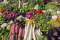 India, West Bengal, Calcutta, Wide selection of locally grown vegetables on sale on street-market stall.