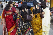 India, Maharashtra, Mumbai, Ladies who lunch: well-dressed, wealthy women, in colourful saris, out shopping in central Bombay.