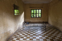 Cambodia, Phnom Penh, One of the cells at Toul Sleng Genocide Museum S-21. Toul Sleng, a high school, was taken over by the Khmer Rouge and turned into a prison, where people were tortured and murdere...