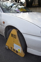 Transport, Road, Cars, Ticket placed on windscreen of clamped untaxed car.