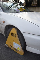Transport, Road, Cars, Ticket placed on windscreen of clamped untaxed car.